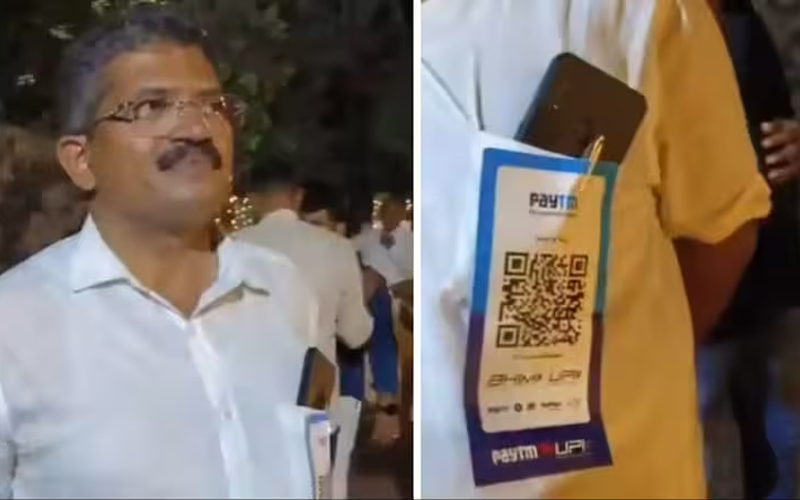 A man was seen wearing a QR code on his shirt's pocket.